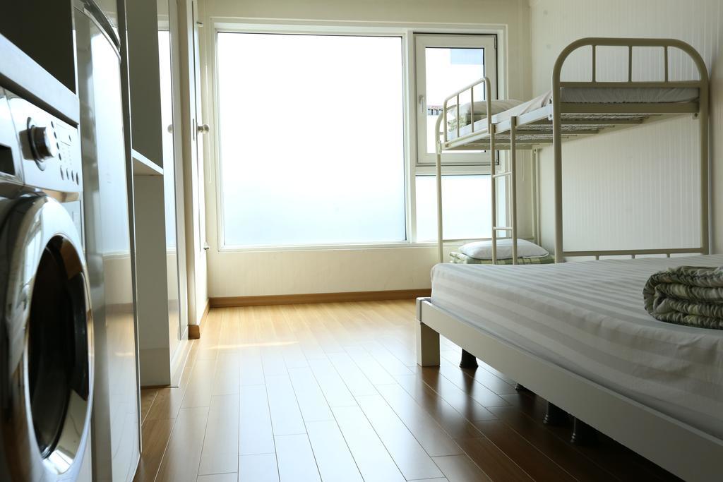 Phil House Albergue Guri Habitación foto