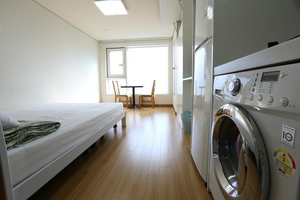 Phil House Albergue Guri Habitación foto